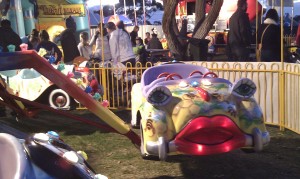 personified car with a face on a sideshow ride 
